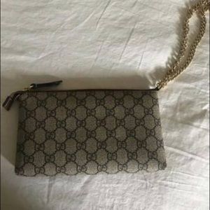 gucci supreme wristlet